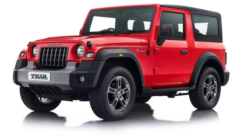 A studio shot of a red 3-door Mahindra Thar SUV, highlighting the model now available at a reduced price due to the Mahindra Thar GST Price Cut.